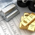 Gold and silver bars on a financial spreadsheet