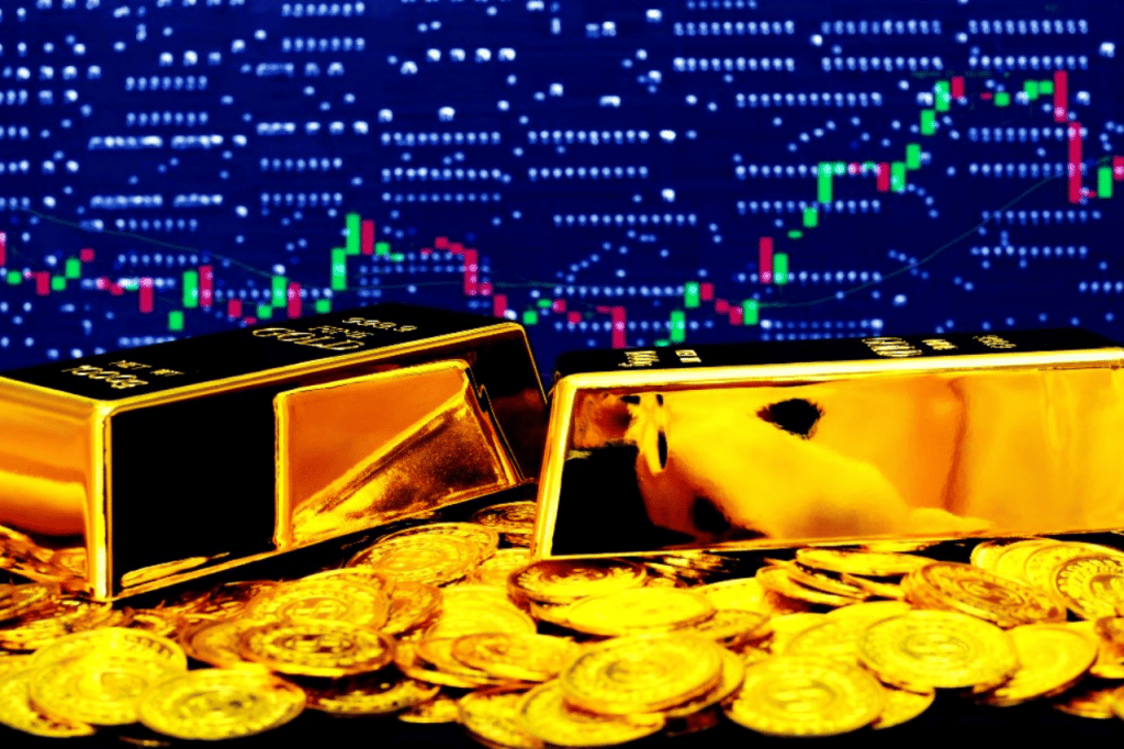 Gold bullion bars and coins on a computer trading chart background